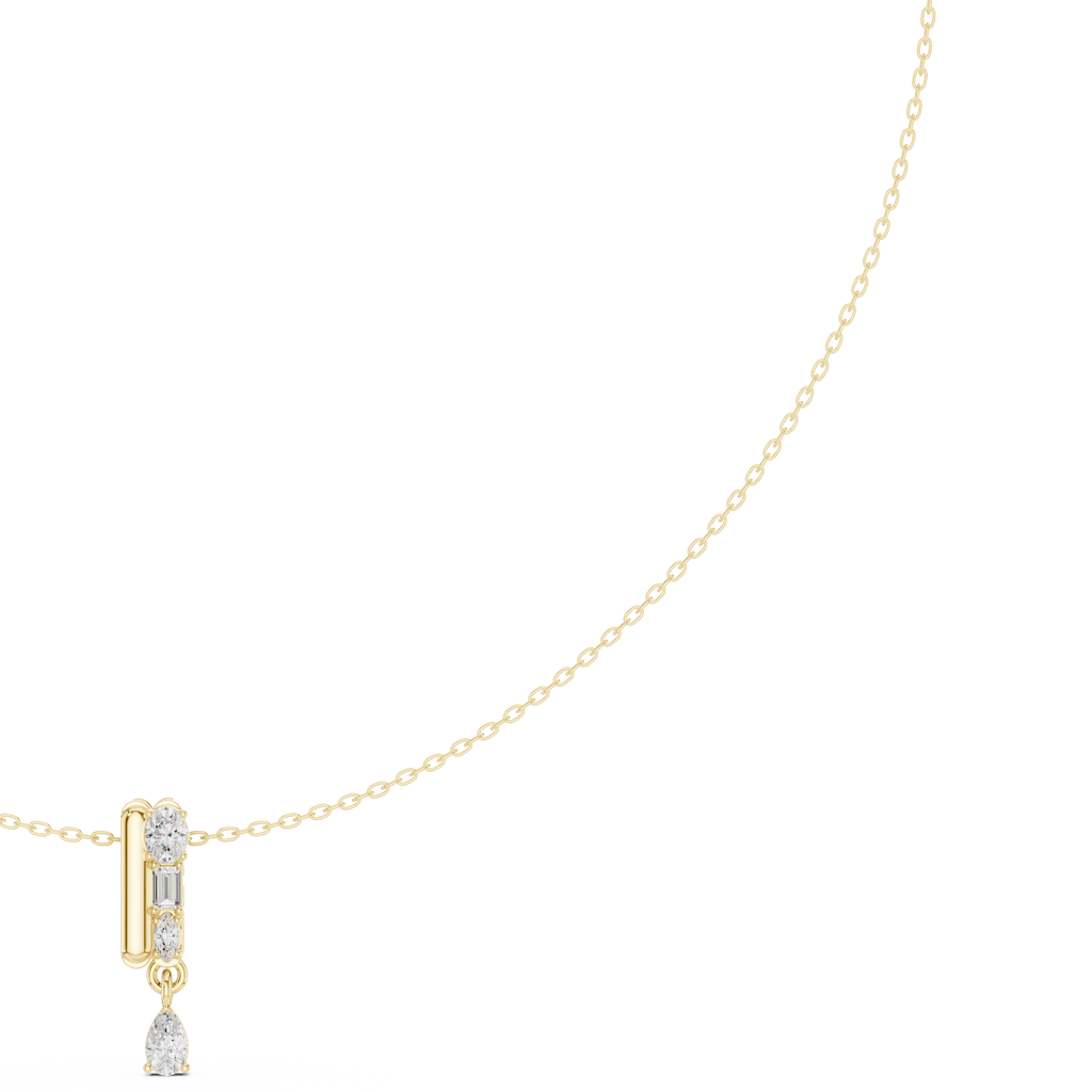 Yellow gold diamond pendant necklace with pear-shaped teardrop center stone, close-up