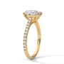 Yellow gold oval diamond ring with pavé band and oval center stone