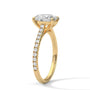 Yellow gold oval diamond ring with pavé band and oval center stone