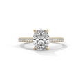 Oval diamond ring in yellow gold with pavé band and raised center stone