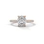 Oval diamond ring in rose gold with pavé band and raised center stone
