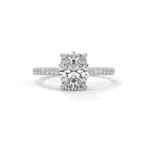 Oval diamond ring in white gold with pavé band and raised center stone