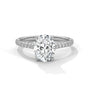 Oval center diamond ring in white gold with pavé band and four-prong setting