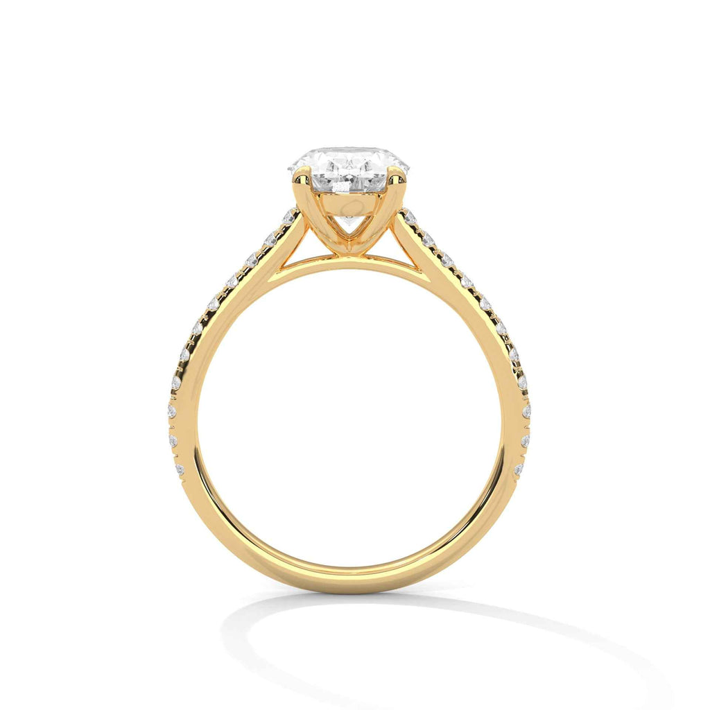 Oval engagement ring in yellow gold with cathedral prongs and pavé-set shoulders