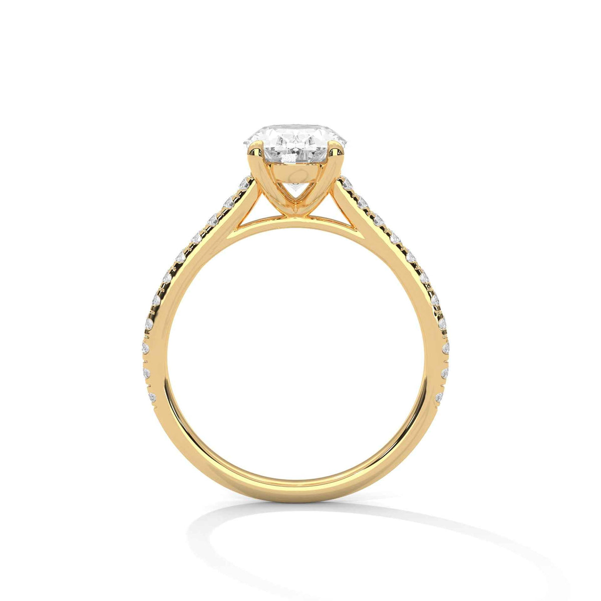 Oval diamond ring in yellow gold with four-prong setting and decorative shoulders