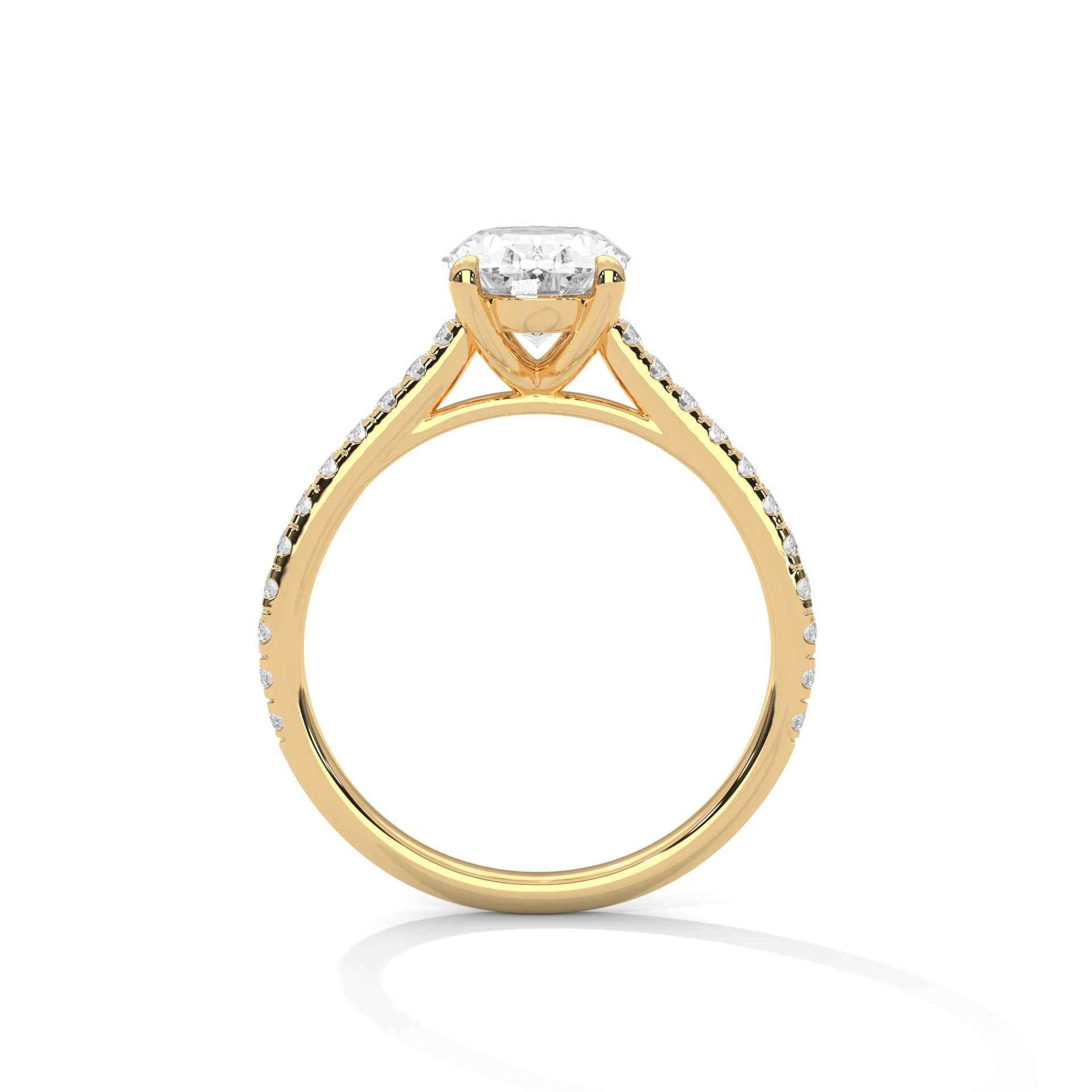 Oval engagement ring in yellow gold with cathedral prongs and pavé-set shoulders