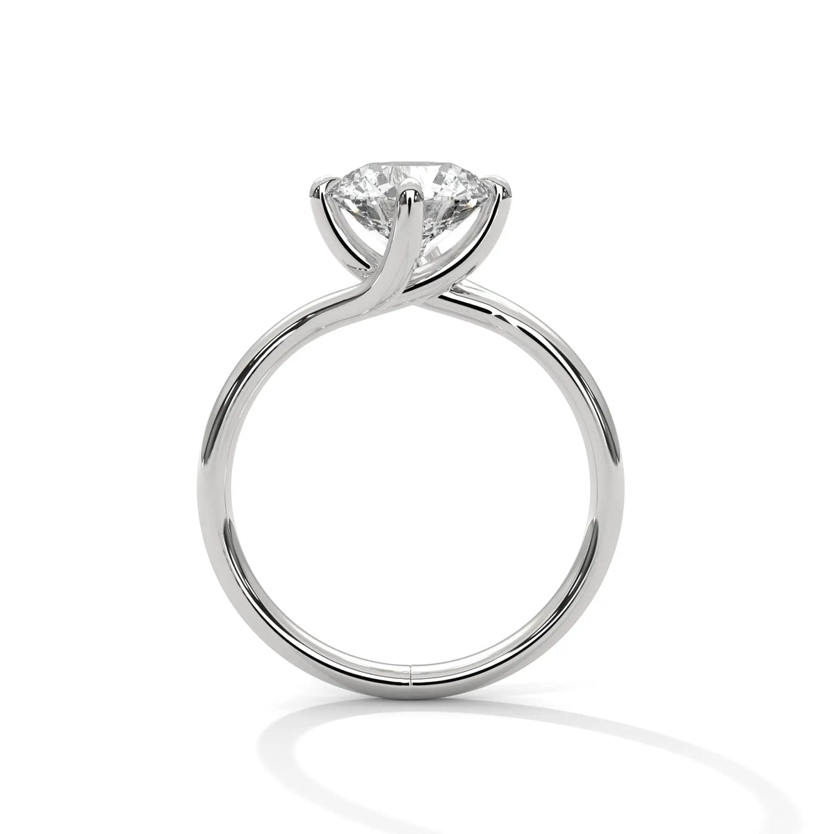 White gold diamond ring with a round center stone and twisted V-shaped setting