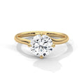 Yellow gold round solitaire engagement ring with prong-set diamond, split band