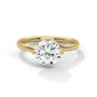 Yellow gold diamond ring with a round center stone and split twisted band