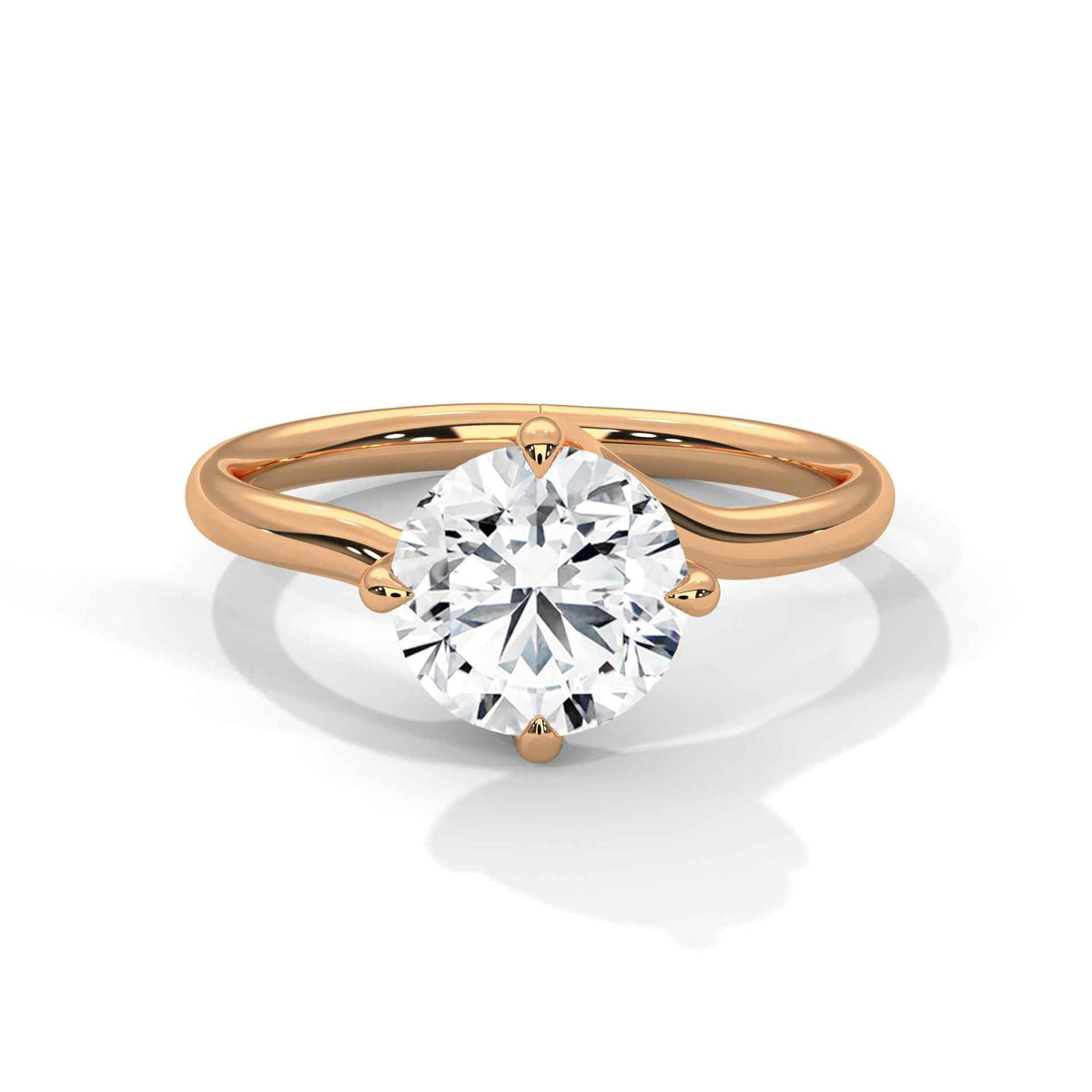 Rose gold diamond ring with a round center stone and twisted V-shaped prong setting