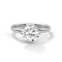 White gold diamond ring featuring a round center stone with a twisted open band