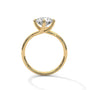 Yellow gold diamond ring with a round center stone and twisted V-shaped setting