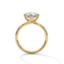 Yellow gold diamond ring with a round center stone and twisted V-shaped setting