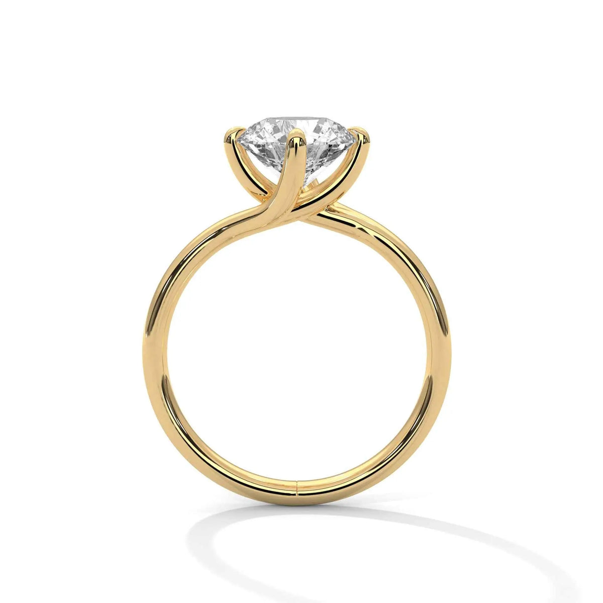 Yellow gold diamond ring with a round center stone and twisted V-shaped setting