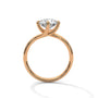 Gold diamond ring with a round center stone and twisted V-shaped prong setting