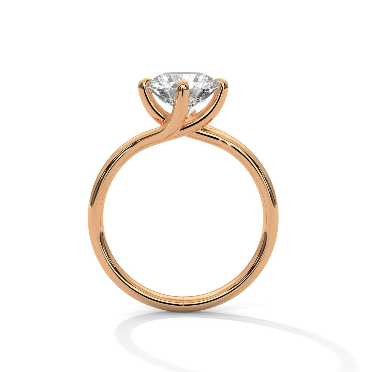 Gold diamond ring with a round center stone and twisted V-shaped prong setting
