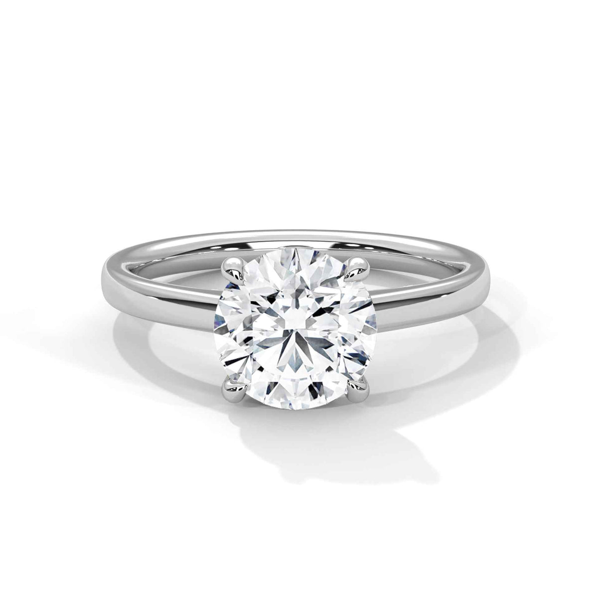 White gold round diamond solitaire ring, raised round center stone and slim band