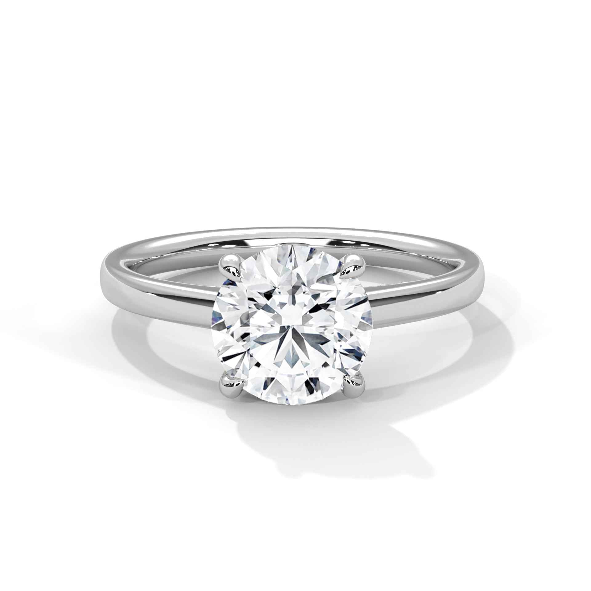 Four-prong round solitaire engagement ring in white gold, with clear round center diamond
