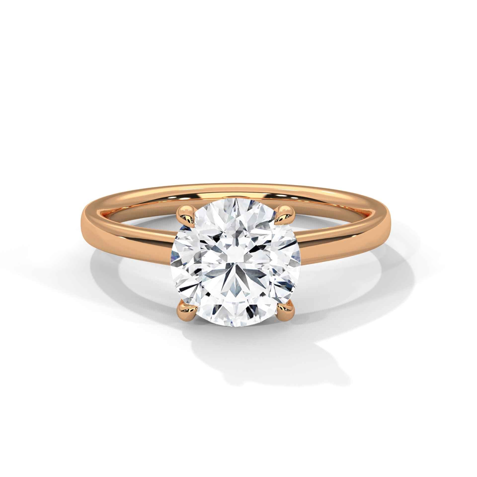 Rose gold four-prong round solitaire engagement ring with clear round center diamond, side view