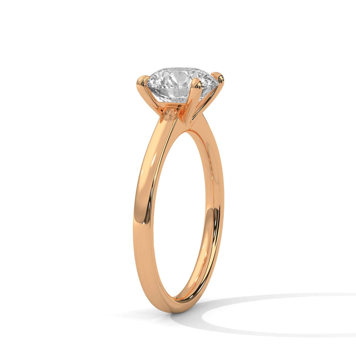 Rose gold round diamond solitaire ring with four-prong setting, side view