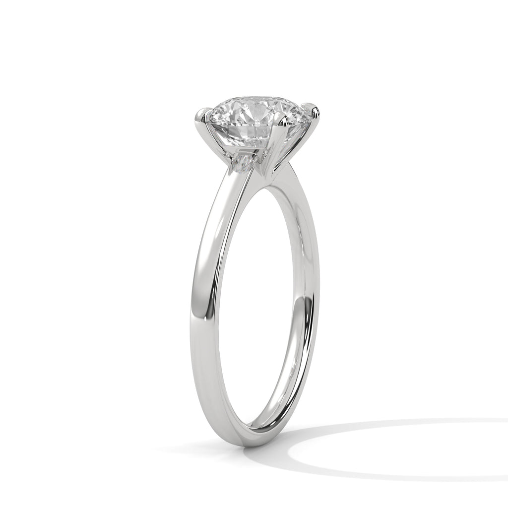 Platinum solitaire engagement ring with round diamond and four-prong setting