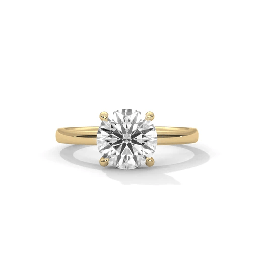 Yellow gold round diamond solitaire ring, centered stone with four prongs
