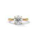 Yellow gold round diamond solitaire ring, centered stone with four prongs
