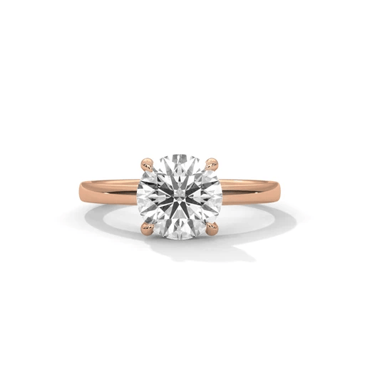 Rose gold round diamond solitaire ring, centered stone with four prongs