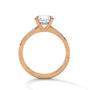 Rose gold diamond engagement ring with a shield-cut center stone and diamond trim