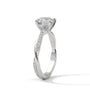 White gold diamond ring with a shield-cut center stone and pave side band