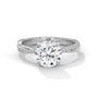 Round diamond ring with white metal twisted band and side pavé accents