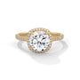 Cushion halo diamond ring with cushion-cut center stone and pavé band in yellow gold