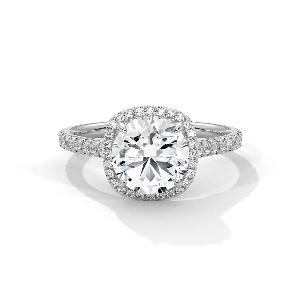 Cushion halo diamond ring with cushion center stone and pavé halo in platinum
