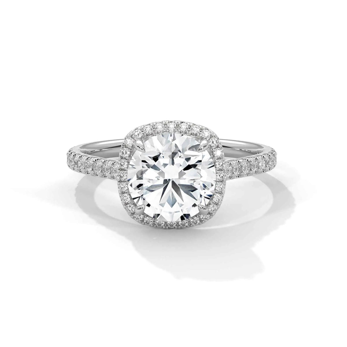 Cushion halo diamond ring with cushion center stone and pavé halo in platinum