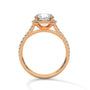 Cushion halo diamond ring in rose gold with pavé details and prong-set cushion center