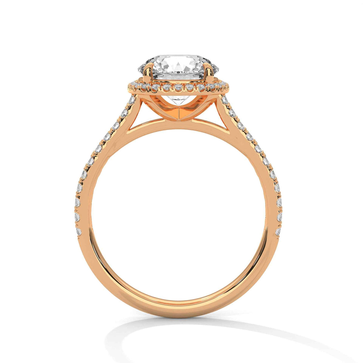 Cushion halo diamond ring in rose gold with pavé details and prong-set cushion center