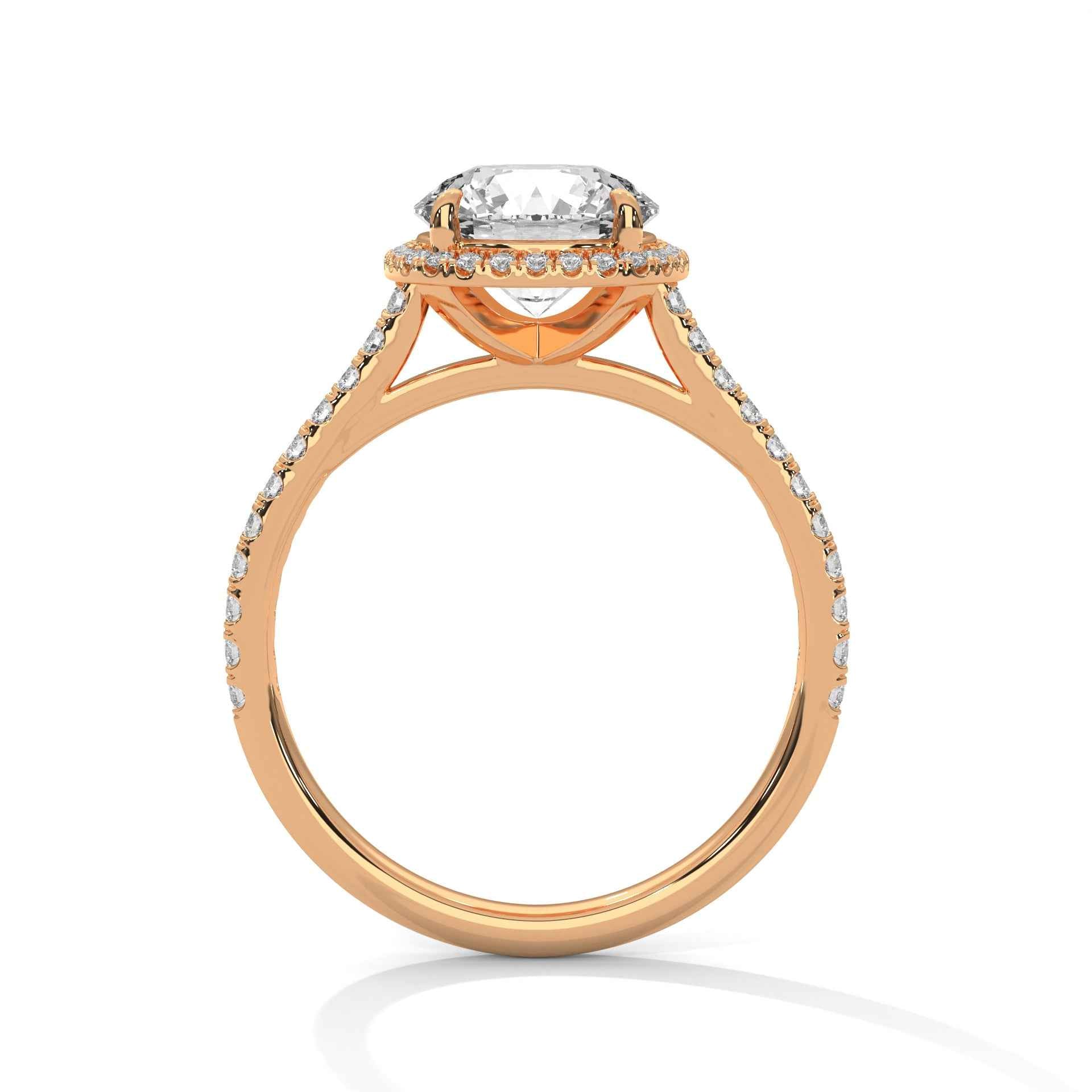 Yellow gold halo round engagement ring with pavé side stones and prong-set center