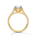 Yellow gold halo round engagement ring with pavé side stones and raised center setting