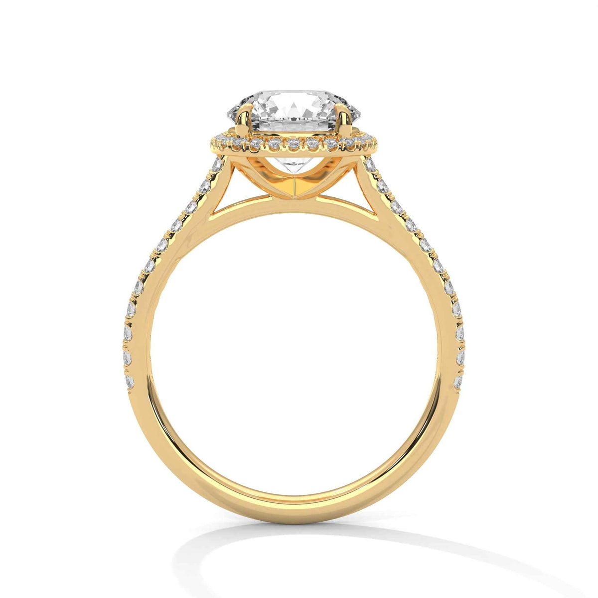 Cushion halo diamond ring in yellow gold with pavé side stones and prong-set center