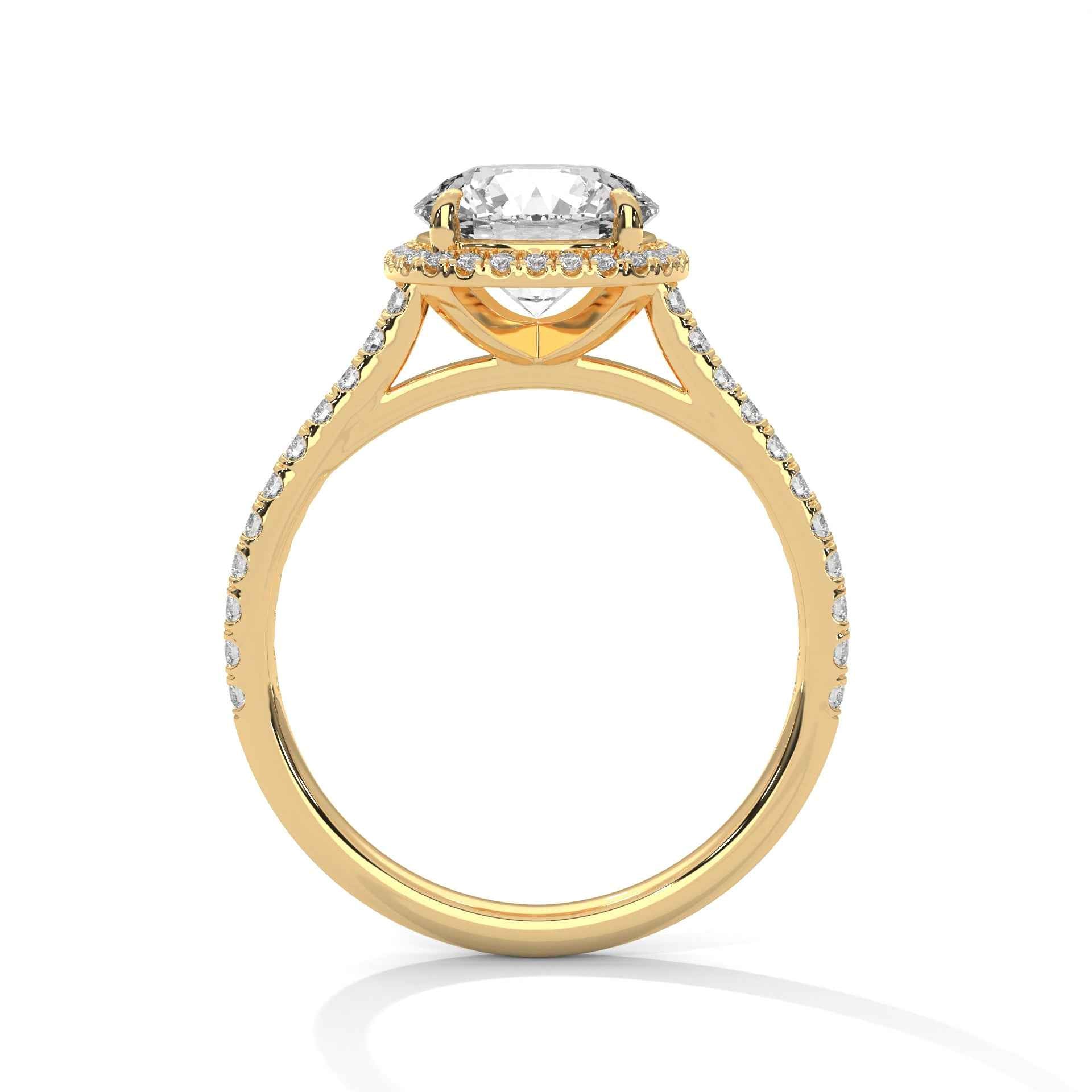 Yellow gold halo round engagement ring with pavé side stones and raised center setting