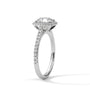 Cushion halo diamond ring side view in platinum with prong-set cushion center and pavé