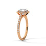 Cushion halo diamond ring side view with pavé stones and prong-set cushion center in rose gold