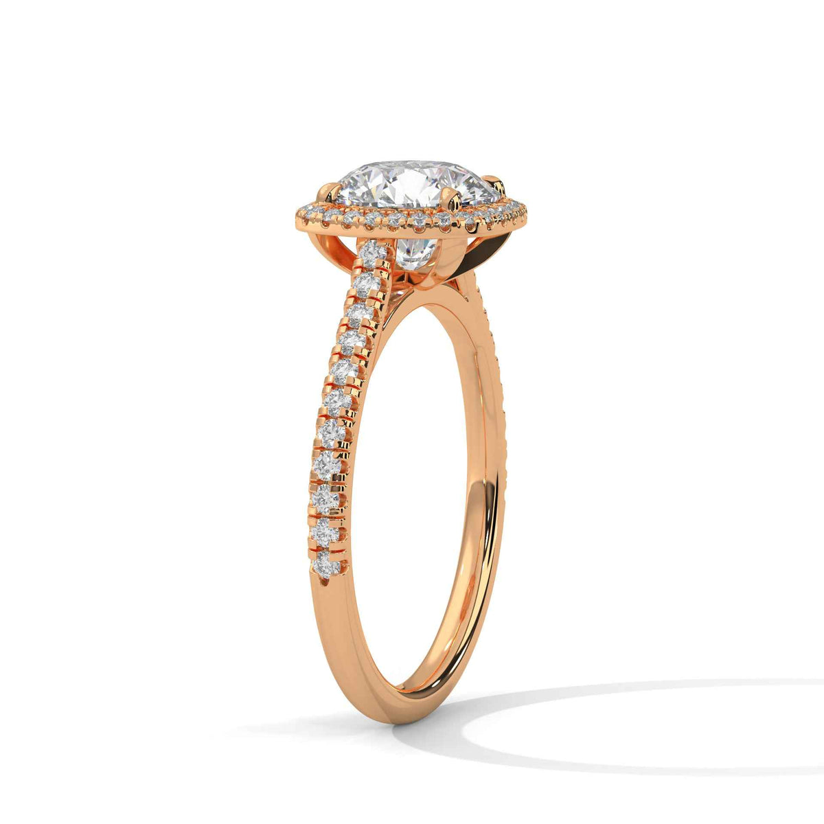 Cushion halo diamond ring side view with pavé stones and prong-set cushion center in rose gold
