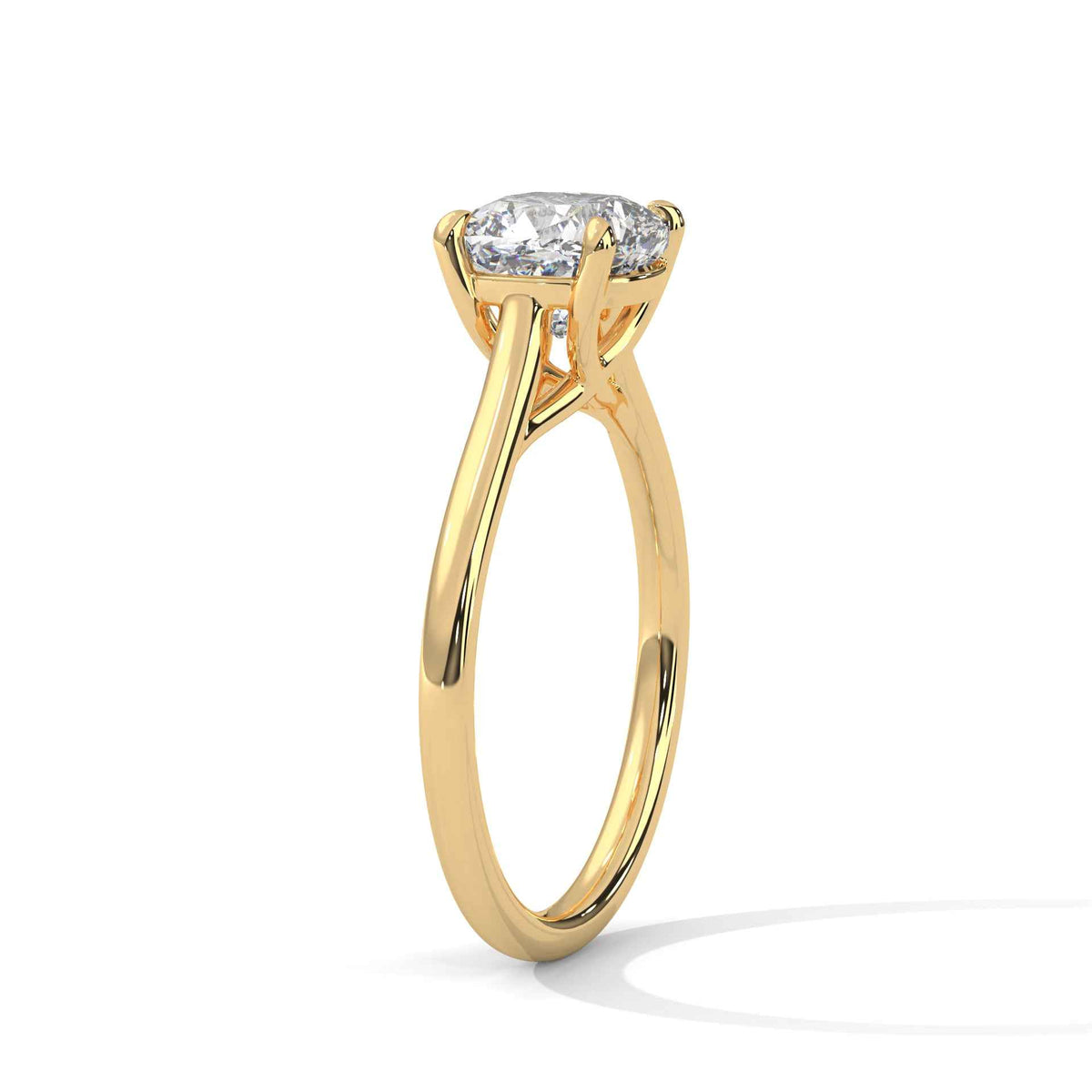 Yellow gold cushion-cut solitaire ring with X-style cathedral prongs