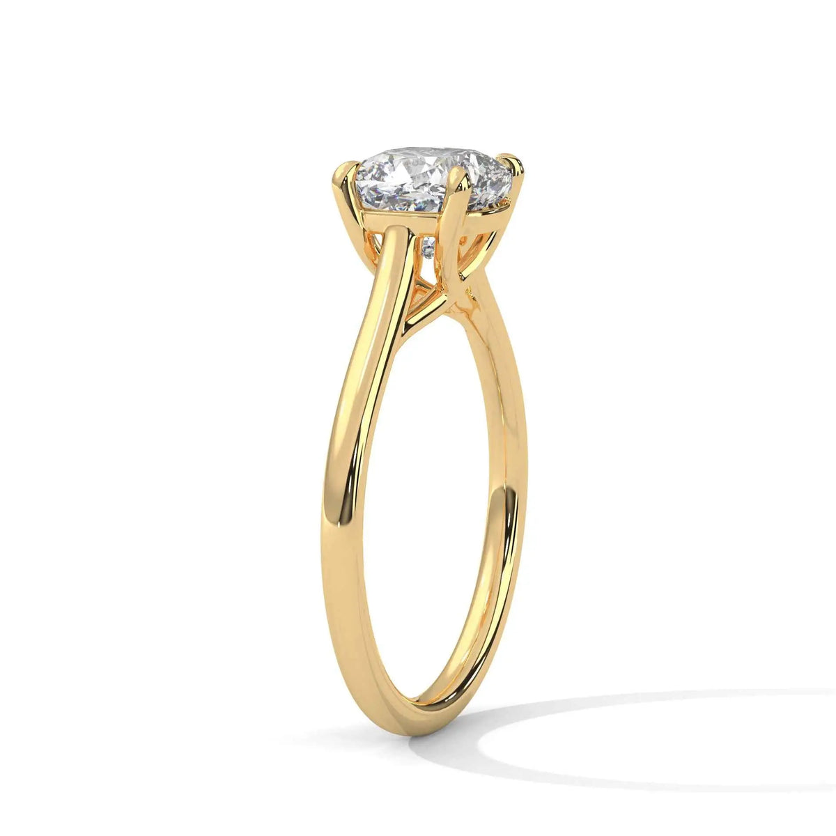 Yellow gold cushion-cut solitaire ring with X-style cathedral prongs