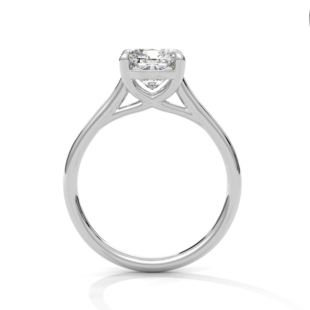 White metal cushion-cut solitaire engagement ring with cathedral prongs