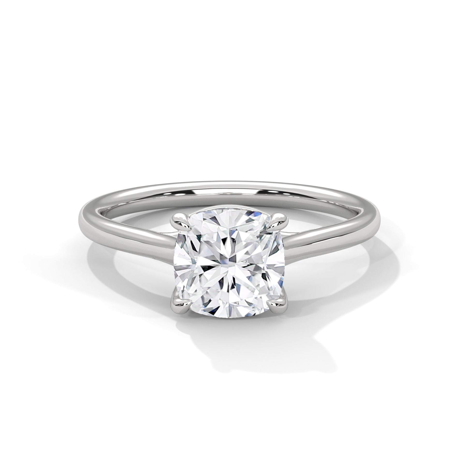 Cushion-cut solitaire engagement ring in platinum, side view with prong-set stone