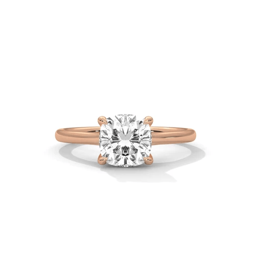 Rose gold cushion-cut diamond solitaire ring, four-prong setting