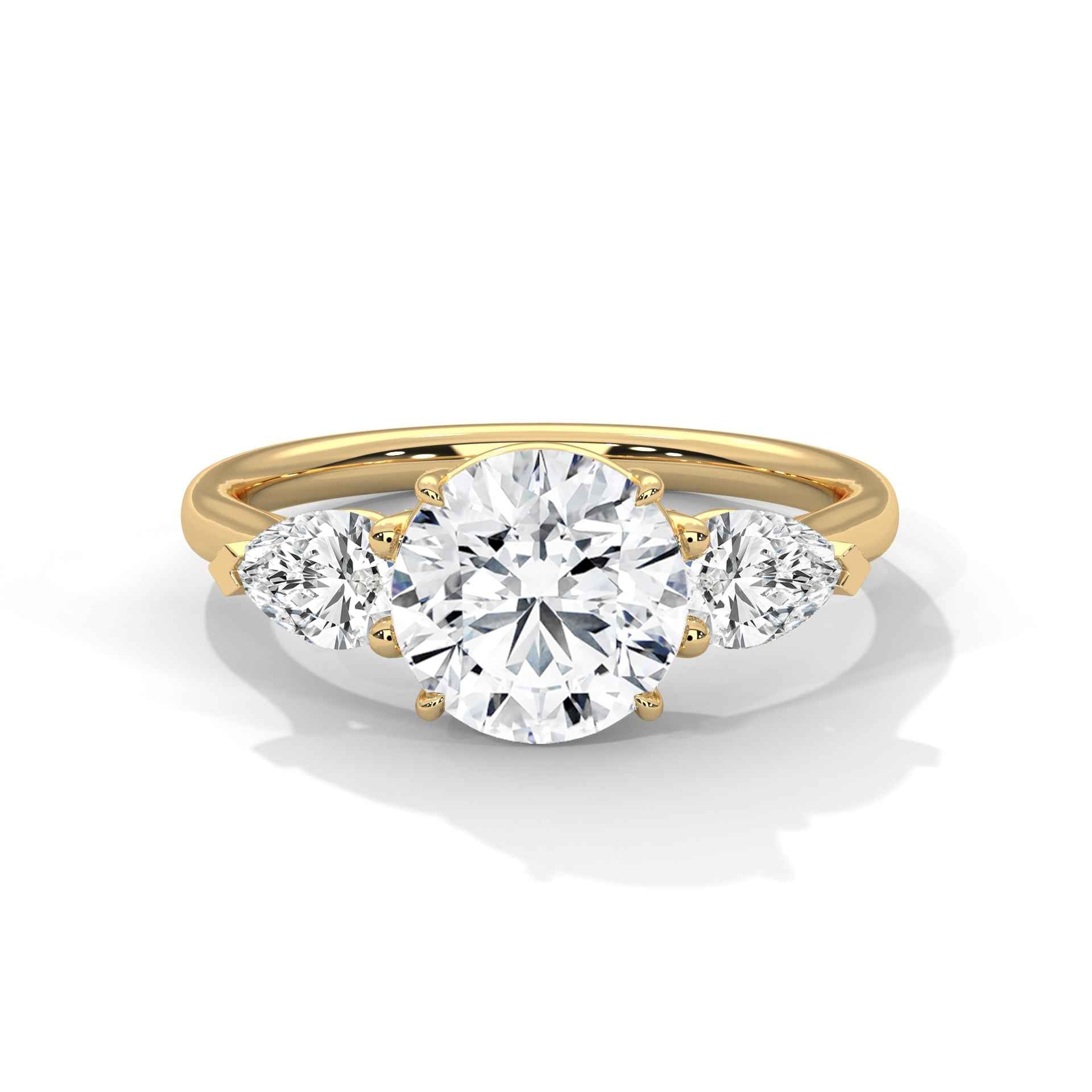 Three-stone diamond ring in yellow gold with a round center stone and two side stones
