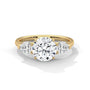 Three-stone diamond ring in yellow gold with a round center stone and two side stones